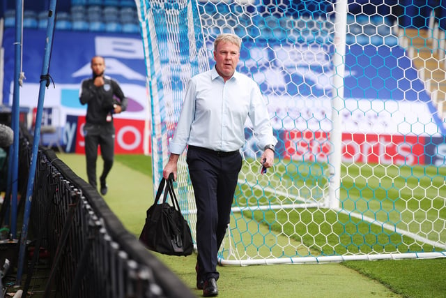 Kenny Jackett walks through an empty Fratton Park stadium on his way to the changing rooms