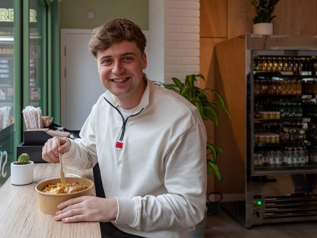 Ben Sharples (24) enjoys a 'Bowl of goodness' salad bowl at Positive Eats. Picture: Mike Cooter (030224)