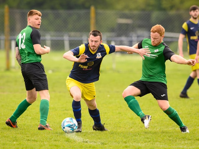 Action from Saturn Royale's 1-0 win over Pelham Arms (blue and yellow kit) in the second Adelaide Cup semi-final. Picture: Keith Woodland (300421-81)