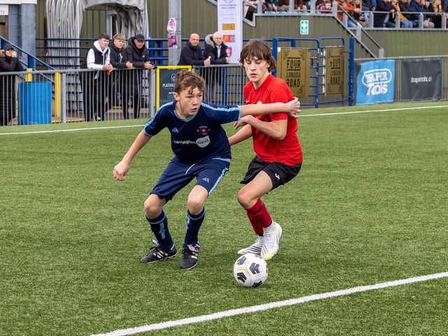 Action from the Under-14 Memorial Challenge Cup final between Pickwick Youth Pumas (all blue kit) and Horndean Youth Red. Picture: Mike Cooter