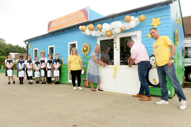 The grand opening of Sophie's Sunflower Art Studio took place on Friday, June 24, which has been built as a charity build at Crofton Anne Dale Federation in Stubbington. This is part of Sophie's Legacy, the charity set up for Sophie Fairall.
Pictured is: (l-r) Sophie's mum Charlotte Fairall and dad (right) Gareth with Caroline Dinenage MP and Clive Saughter.
Picture: Sarah Standing (240622-897)