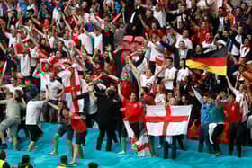 Fans in the crowd at Wembley Stadium on June 29, 2021 in London, England. Photo by Matthew Childs - Pool/Getty Images