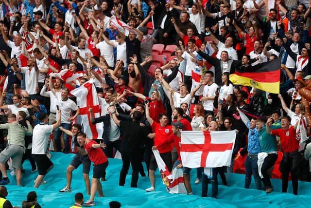 Fans in the crowd at Wembley Stadium on June 29, 2021 in London, England. Photo by Matthew Childs - Pool/Getty Images