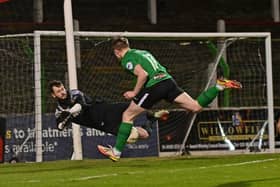 Glenavon goalkeeper Rory Brown pulls off a save to deny reported Pompey target Terry Devlin.