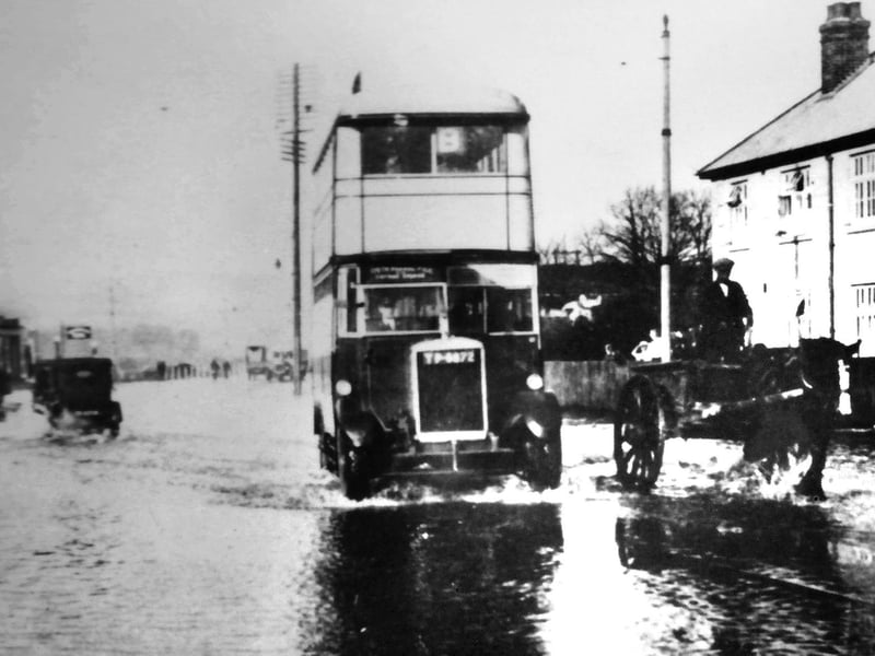 Water everywhere
Ploughing through flood water at Hilsea a bus travels south leaving a wake.