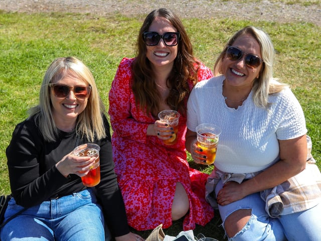 Hayley Lott, Sarah Craig and Kim Ovington-Cowper enjoy a drink in the sunshine at Portsmouth Chilli and Gin Festival, Fort Purbrook.