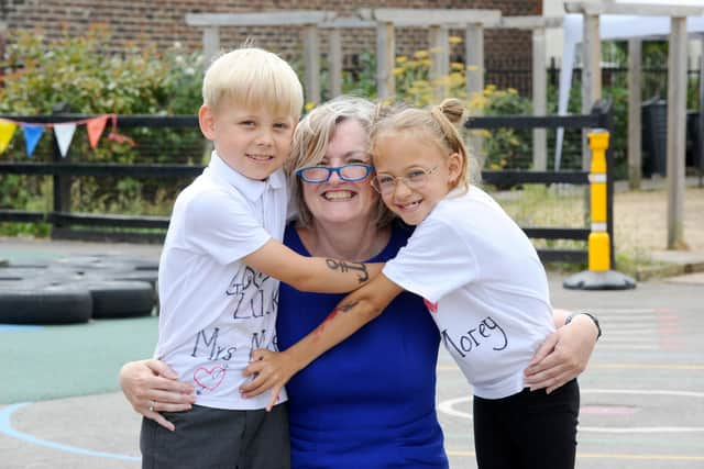 Karen Morey with pupils Wilfred Taw, seven, left, and Florence O'Halloran 
Picture: Sarah Standing (210722-7599)