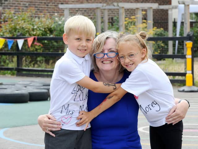 Karen Morey with pupils Wilfred Taw, seven, left, and Florence O'Halloran 
Picture: Sarah Standing (210722-7599)