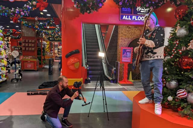 The Royal Navy officers filmed the music video for their charity single in iconic London toy shop Hamleys.