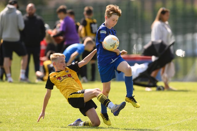 Action from the Clanfield youth football tournament at Horndean Technology College. Picture: Keith Woodland (270521-450)