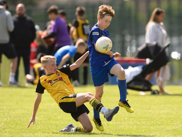 Action from the Clanfield youth football tournament at Horndean Technology College. Picture: Keith Woodland (270521-450)