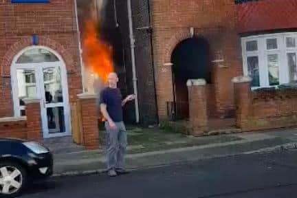 Daniel Wakelin, 44, pictured retreating from the blazing home in Torrington Road, North End, after valiantly attempting to break in and rescue a 101-year-old woman who was trapped inside.
Picture from video clip