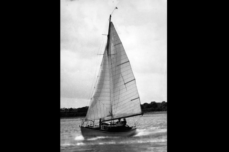 Boat under sail on Fareham Creek.