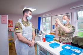 Major Mike Rawden preparing a dose of the vaccine at St James' Hospital, Portsmouth

Picture: Habibur Rahman