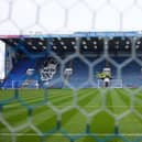 Mosaics depicting Jimmy Dickinson and the Pompey crest have overlooked the Fratton Park pitch since 1997.