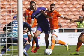 Christian Burgess of Portsmouth in the Blackpool box during the EFL Sky Bet League 1 match between Blackpool and Portsmouth at Bloomfield Road, Blackpool, England on 31 August 2019.
