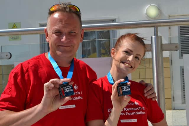 Simon and Megan Jansen after completing the abseil. 