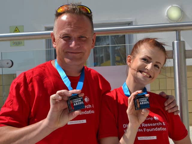 Simon and Megan Jansen after completing the abseil. 