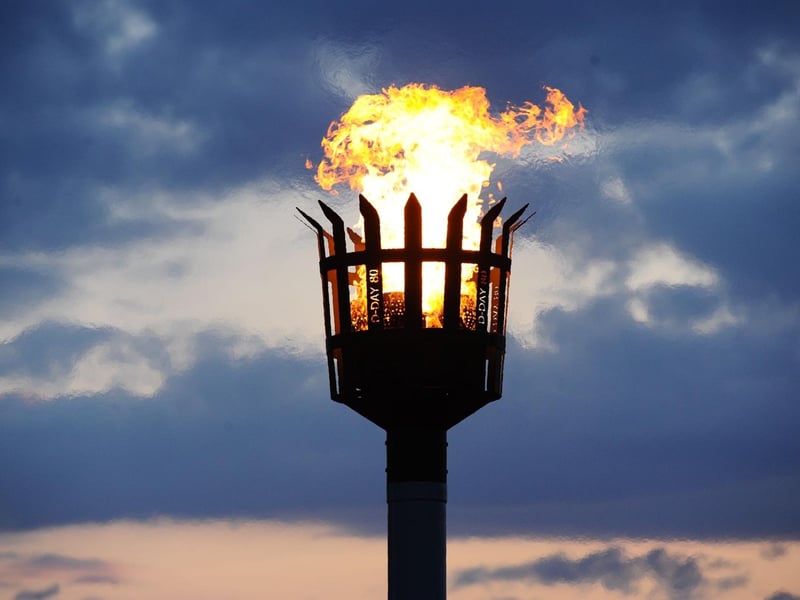 The beacon includes detail signifying D-Day 80
