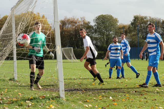 Lakeside score their consolation goal in a Portsmouth & District FA Trophy loss to AC Copnor. Picture by Kevin Shipp.