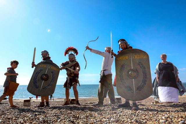 Members of Butser IX Legion, from left, Jack de Backer, 8, Gareth de Backer, centurion Mark Scanlan, archer Mark Gilbert, Arthur de Backer, 10, and Louisa de Backer.
