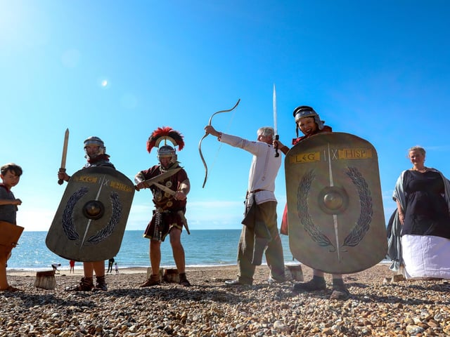 Members of Butser IX Legion, from left, Jack de Backer, 8, Gareth de Backer, centurion Mark Scanlan, archer Mark Gilbert, Arthur de Backer, 10, and Louisa de Backer.