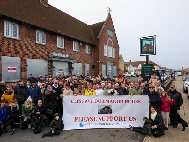 Campaigners outside the Manor House pub, Drayton, where they objected to owners Greene King's closure of the community hub in November. Picture: Chris Moorhouse