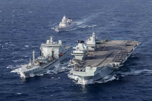 Pictured: HNLMS Evertsen approaches RFA Tidespring and HMS Queen Elizabeth to conduct a double replenishment at sea.