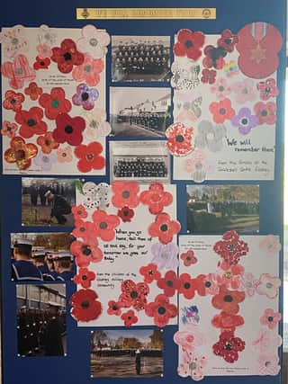 The 'We Will Remember Them' display produced by children from naval families.