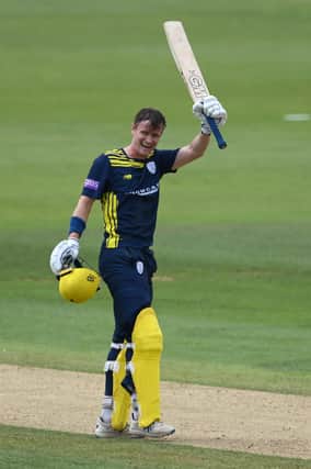 Nick Gubbins celebrates reaching his century during the Royal London Cup tie against Sussex. Photo by Mike Hewitt/Getty Images.