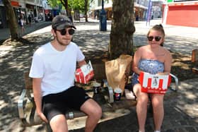 Jack Honess, 19 and Bethany Becque, both 19 and from Portsmouth, enjoying their KFC 
Picture: Sarah Standing (010620-9301)