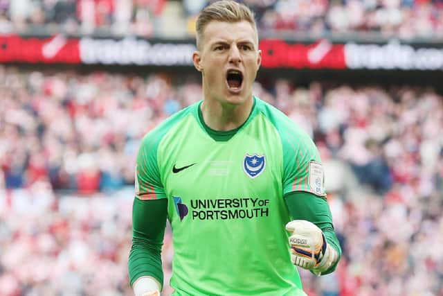 Craig MacGillivray celebrates saving Lee Cattermole's penalty in the Checkatrade Trophy final. Picture: Joe Pepler