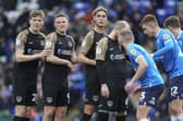 Portsmouth defender Sean Raggett, Portsmouth forward Colby Bishop, Portsmouth defender Ryley Towler during the EFL Sky Bet League 1 match between Peterborough United and Portsmouth at London Road, Peterborough, England on 28 January 2023.