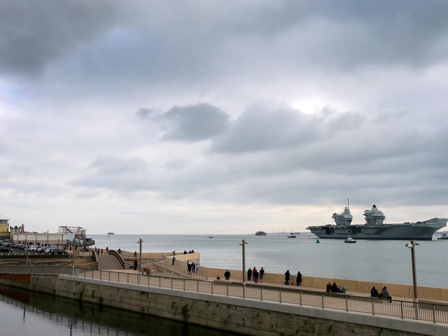 A number of people watched the ship's return home
