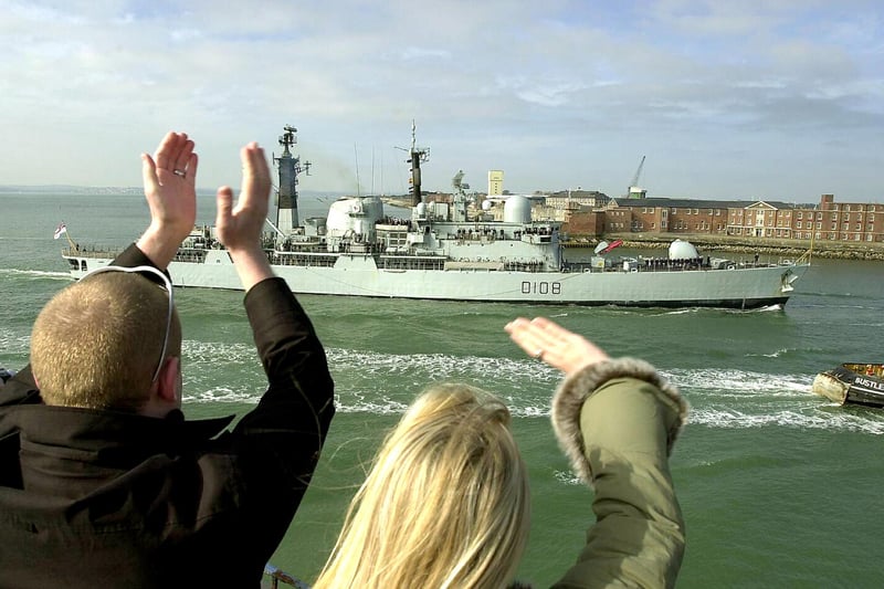 HMS Cardiff is welcomed home by families and friends at The Round Tower at Old Portsmouth 4th April 2003. Picture: Malcolm Wells\The News Portsmouth ( 031670-0042 )