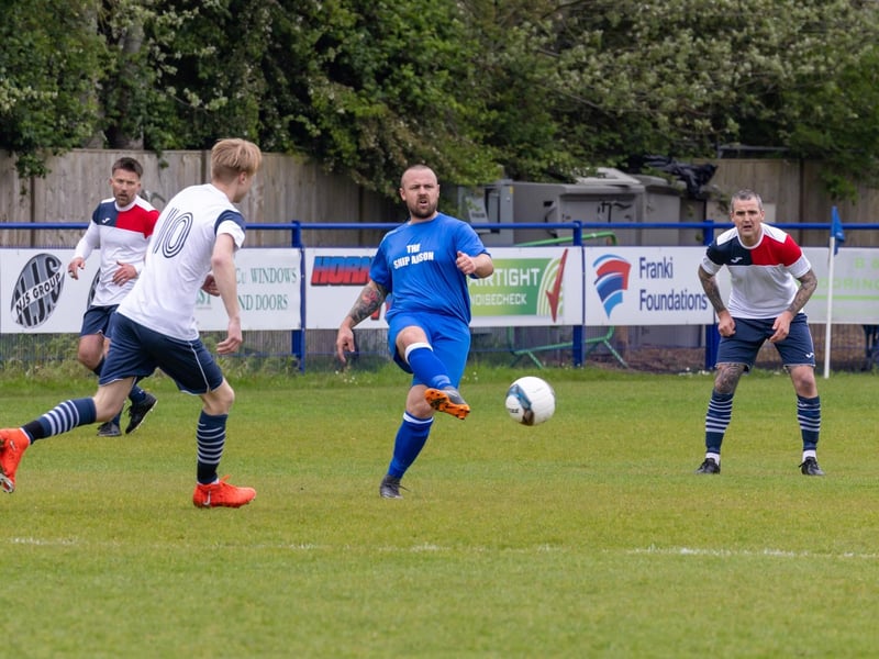 A Portsea player spreads the play in the charity football match in honour of Sherie Shepherd.