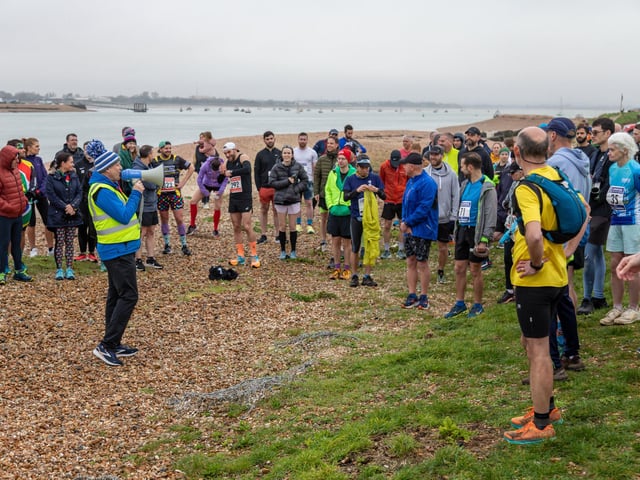 Event organiser Rob Piggott briefs the runners at the Langstone Harbour Half Marathon Picture: Mike Cooter (170224)