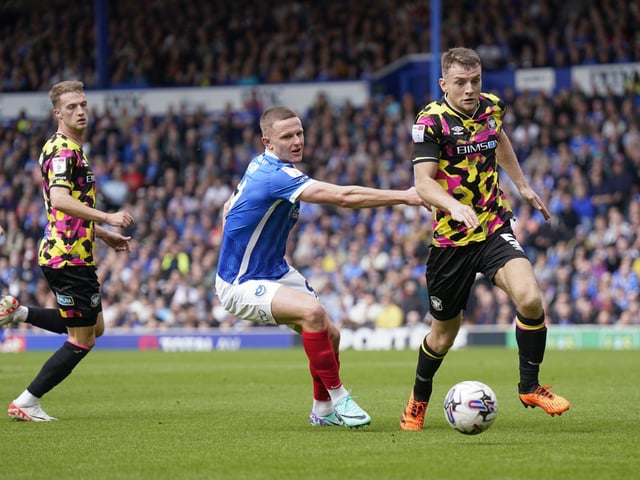 Colby Bishop puts pressure on the Carlisle defence.