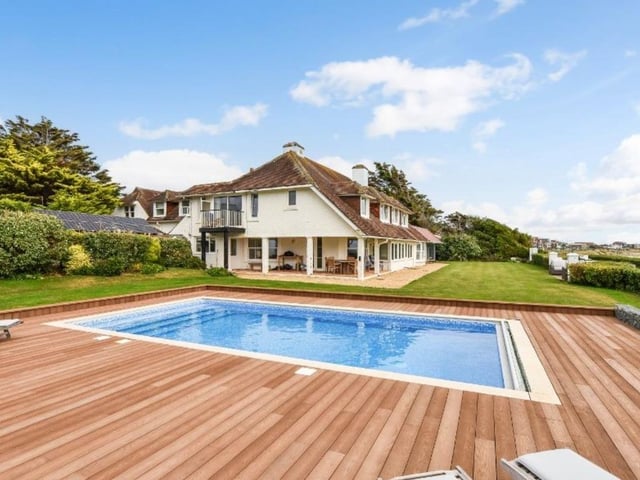 This property comes with six bedrooms, four bathrooms and five reception rooms as well as a heated pool, a gym and a large decked area. This home is on the market for offers over £3,000,000 and it is being sold with Jeffries & Dibbens Estate Agents. The listing says: "Comprising of approximately 7160 square feet, this impressive family home is situated on Hill Head Seafront and boasts panoramic views across the Solent to the Isle of Wight." For more information about the property, visit Zoopla.