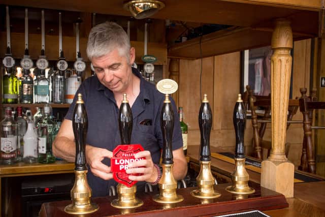 Pub landlord, Phil Estell, preparing to open his pub, The Golden Eagle in Southsea on 23 June 2020.
Picture: Habibur Rahman