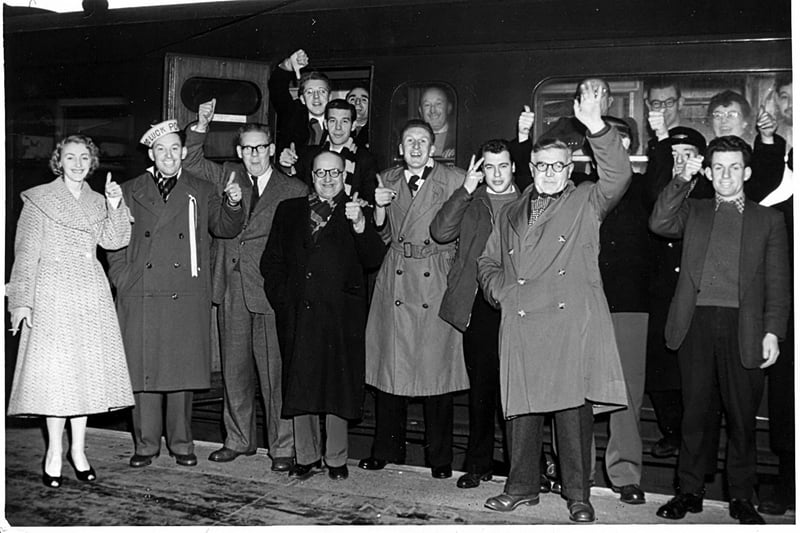 Seen in late, late 1950's we see Pompey supporters boarding a train for Wolverhampton to see Pompey play in an F.A. Cup game.  Wolves won says Mr Jenkins of Purbrook who sent it in. He is in the doorway with the thumb pointing downwards.