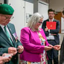 Veterans Minister, Johnny Mercer is visiting veterans HMS Sultan in Gosport on Wednesday 27th September 2023. Pictured: Johnny Mercer handing over an ID card to Helen Field at HMS Sultan, Gosport. Picture: Habibur Rahman