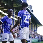 Abu Kamara celebrates with Christian Saydee after netting Pompey's second goal against Peterborough. Picture: Jason Brown/ProSportsImages