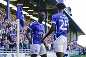 Abu Kamara celebrates with Christian Saydee after netting Pompey's second goal against Peterborough. Picture: Jason Brown/ProSportsImages