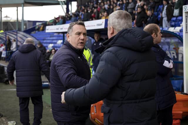 Micky Mellon and Pompey manager Kenny Jackett shake hands. Photo by Daniel Chesterton/phcimages.com.