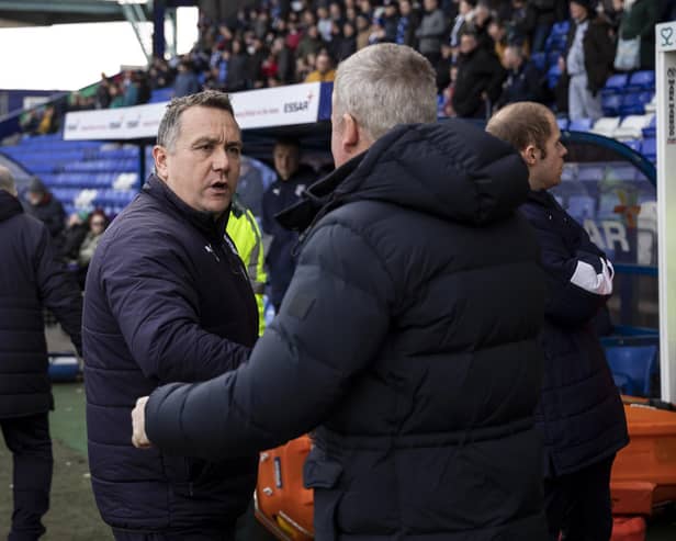 Micky Mellon and Pompey manager Kenny Jackett shake hands. Photo by Daniel Chesterton/phcimages.com.