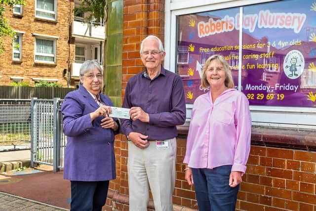 The £1,200 cheque donated to The Robert's Centre in Portsmouth. Pictured: Carole Damper MBE (65, Chief Executive of The Roberts Centre), Bill Edwards MBE (78, Chair of the Allens Road Street Party Association) and Cherry Rattue (68) - a member of the street party committee, who individually raised £380. Picture: Mike Cooter (210622)