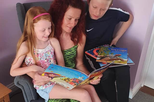 Teacher, Clare Armstrong, enjoys reading with her two children, Alfie Armstrong, 11, and Ella Armstrong, 7.