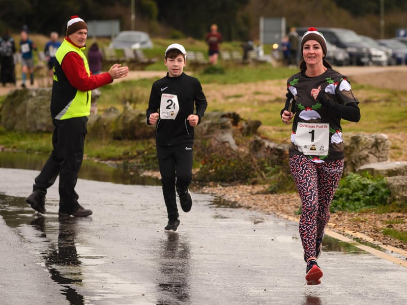 Two runners make a dash for the finish at the Christmas Pud 5k, Stokes Bay, Gosport