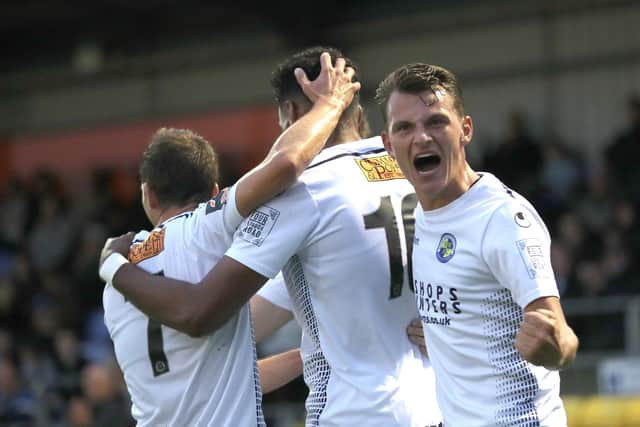 Alfie Rutherford, right, celebrates a Hawks goal during the 6-0 win over Dorking early in 2019/20. Pic: Dave Haines.